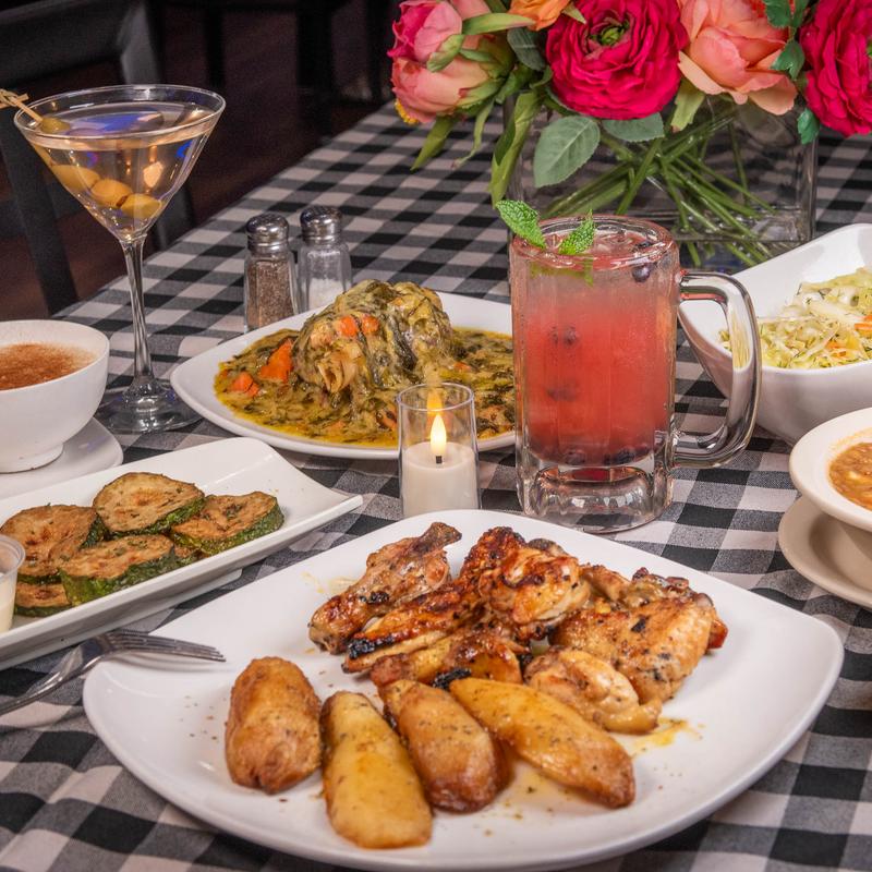 A Greek feast of grilled chicken, roasted potatoes, salad and cocktails